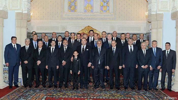 Morocco's King Mohammed (front center) and Crown Prince Moulay Hassan pose for a family picture with members of the new cabinet