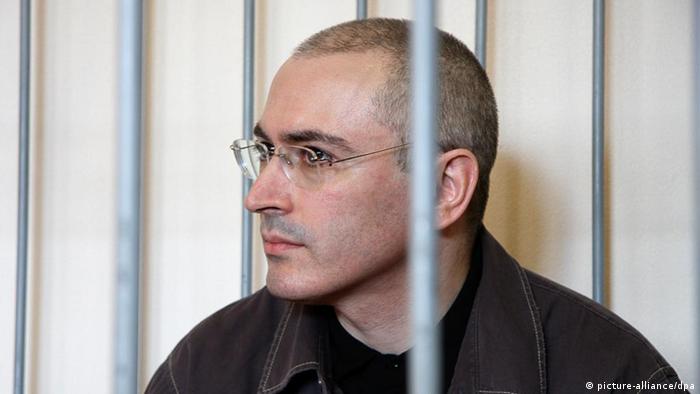 Mikhail Khodorkovsky behind bars during trial