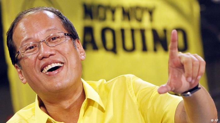 Presidential candidate Senator Benigno "Noynoy" Aquino III flashes the "L" sign (for Laban meaning Fight) during a live televison program Tuesday, May 4, 2010 in a sports stadium in  Manila, Philippines. Aquino, an opposition senator and son of the country's denocracy icon the late President Corazon Aquino, has widened lead over his closest rivals in the race for presidency, an independent survey said. (AP Photo/Pat Roque)
