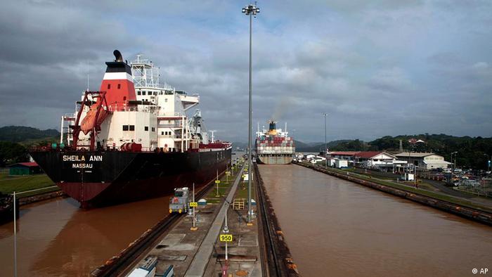 Two cargo ship sail through Miraflores locks on the Panama Canal in Panama City, Thursday, Dec. 30, 2010. (Photo: AP)