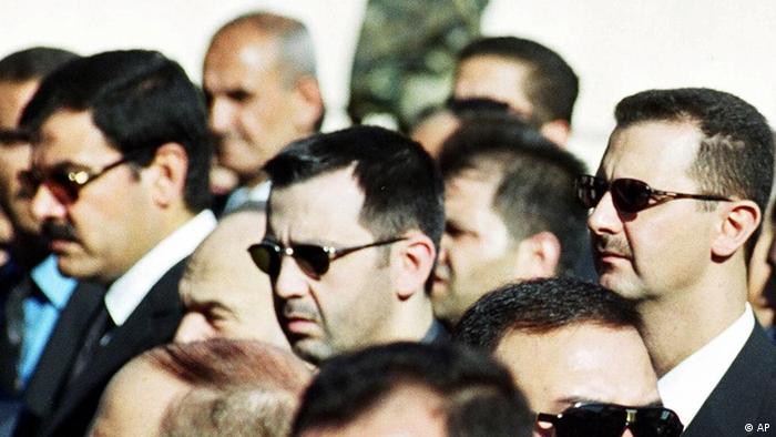 Syrian President Bashar al-Assad, right, his brother Maher, centre, and brother-in-law Major General Assef Shawkat, left, stand during the funeral of late president Hafez al-Assad in Damascus on June 13, 2000. Syria is considering a U.N. request to interview six top officials about the slaying of a former Lebanese leader, a Foreign Ministry official said Monday, while declining to disclose the identities of the people that the U.N. investigators want to question except that they want to see Gen. Assef Shawkat, the brother-in-law of Syrian President Assad, among others. (AP Photo)
