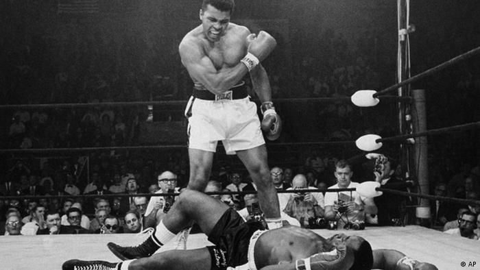 Heavyweight champion Muhammad Ali stands over fallen challenger Sonny Liston, shouting and gesturing shortly after dropping Liston with a short hard right to the jaw on May 25, 1965, in Lewiston, Maine. The bout lasted only one minute into the first round. Ali is the only man ever to win the world heavyweight boxing championship three times. He also won a gold medal in the light-heavyweight division at the 1960 Summer Olympic Games in Rome as a member of the U.S. Olympic boxing team. In 1964 he dropped the name Cassius Clay and adopted the Muslim name Muhammad Ali. (AP Photo/John Rooney)
