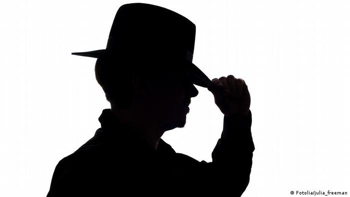silhouette; man; hat; hand; touch; detective; shade; spy; agent; isolated; unknown; mysterious; one; white; dark
