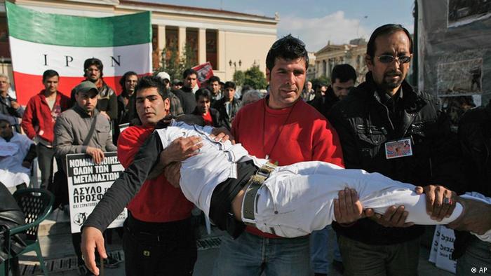 An Afghan immigrant with his lips sewn shut, is carried after collapsing during an one-month hunger strike in Athens, Thursday, Jan. 27, 2011
(AP Photo/Alkis Konstantinidis)