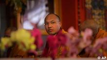 Tibetan Buddhism's third most important leader Ugyen Thinley Dorje, the 17th Karmapa, attends a teaching session of the Dalai Lama during the Kalachakra Buddhist festival in Bodh Gaya,  Bihar state, India, Sunday, Jan. 8, 2012. Bodh Gaya, is believed to be the place where Buddha attained enlightenment. (AP Photo/Altaf Qadri)