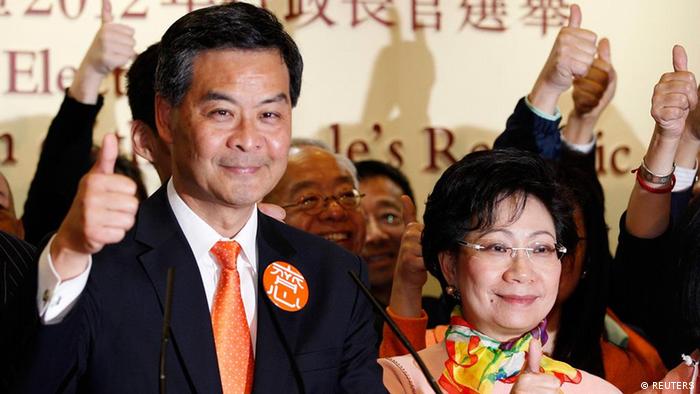 The next Hong Kong Chief Executive Leung Chun-ying celebrates after winning the chief executive election, at a vote counting station in Hong Kong March 25, 2012. An election committee of 1,200 Hong Kong notables picked Beijing-loyalist Leung as the city's next leader on Sunday following an election campaign marred by scandals and a tide of public discontent at a high degree of perceived interference from Beijing over the 