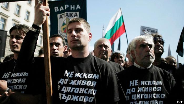Members of of  nationalist party "Ataka" wear T-shirst with the words "I  don't want to live in a Gypsy country" during a protest in front  Bulgarian Presidency building, Sofia, Saturday, Oct. 1, 2011. The  Bulgarian President Georgi Parvanov's says the National Security Council  is holding an emergency meeting to discuss rising ethnic tensions as  nationalist groups stage anti-Roma rallies across the country. (ddp  images/AP Photo/Valentina Petrova)