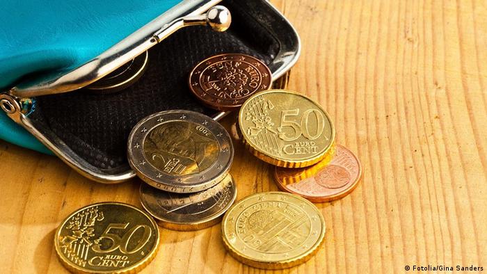 Euro coins in small coin pouch