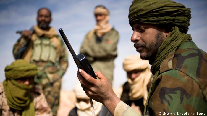 A Tuareg rebel with a satellite telephone in northern Mali. 