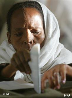 An Ethiopian woman casts her vote at a polling station in Addis Ababa, Ethiopia Sunday, May 15, 2005 during the third democratic elections in Ethiopia's 3,000-year history. (AP Photo/Karel Prinsloo)