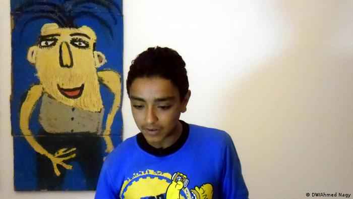 Mostapha (13 years) with on of his painting 