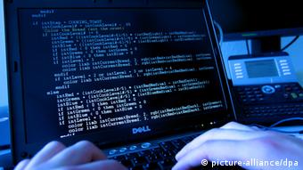 A stock picutre simulating a hacker writing code.