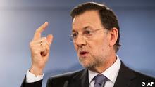 Spain's Prime Minister Mariano Rajoy with raised right finger 