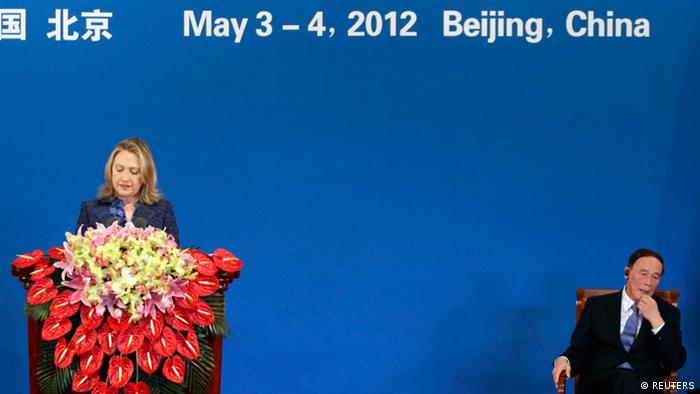 U.S. Secretary of State Hillary Clinton (L) speaks as China's Vice Premier Wang Qishan listens during the opening ceremony of the U.S.-China Strategic and Economic Dialogue at the Diaoyutai State Guesthouse in Beijing May 3, 2012. REUTERS/Jason Lee (CHINA - Tags: POLITICS)  