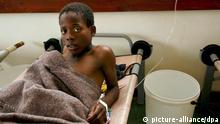 A cholera patient in a hospital bed in Zimbabwe