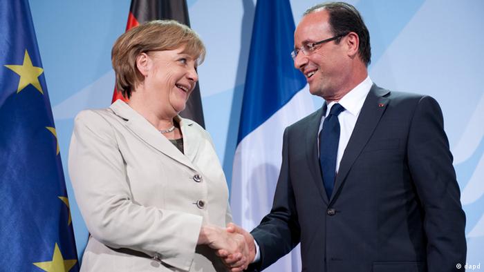 President Francois Hollande pictured with Chancellor Angela Merkel during his first visit to Berlin on May 15, 2012


