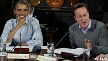 President Barack Obama, left, listens to British Prime Minister David Cameron