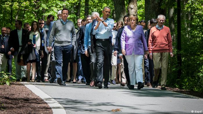 Merkel and Obama walking with other leaders in tow at Camp David
