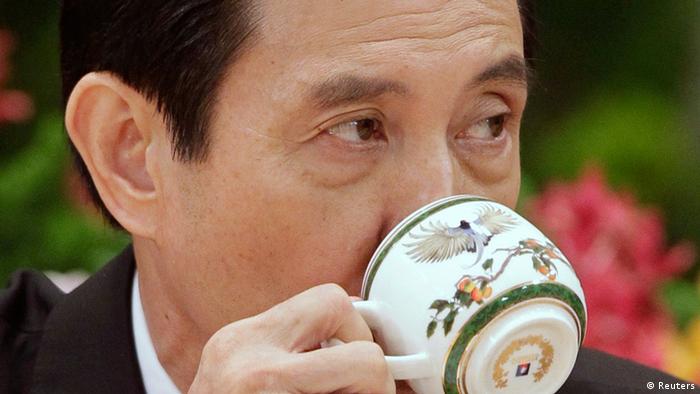 Taiwan President Ma Ying-jeou takes a sip from a cup during a news conference after his inauguration ceremony at the Presidential Office in Taipei May 20, 2012. Ma took office on Sunday for his second term. REUTERS/Pichi Chuang (TAIWAN - Tags: POLITICS)          