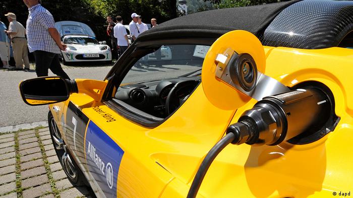 A Tesla car is charged following usage in the E-Miglia rally, for electric cars