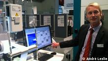 Martin Lehmköster, Key Account Manager, ISRA Vision shows his system of testing at the Automatica Fair in Munich.