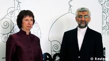 European Union foreign policy chief Catherine Ashton (L) and Iran's chief negotiator Saeed Jalili pose for the media before their meeting in Baghdad May 23, 2012. REUTERS/Thaier al-Sudani (IRAQ - Tags: POLITICS)