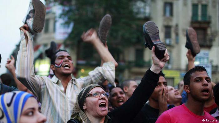 Source News Feed: EMEA Picture Service ,Germany Picture Service 
Protesters wave their shoes during a protest against presidential candidates Mohamed Mursi and Ahmed Shafiq at Tahrir square in Cairo May 28, 2012. Egypt will hold a run-off next month in its first truly contested presidential election in which the Muslim Brotherhood's Mursi will face Shafiq, the last prime minister of deposed leader Hosni Mubarak. REUTERS/Suhaib Salem (EGYPT - Tags: POLITICS ELECTIONS CIVIL UNREST)// eingestellt von se 


