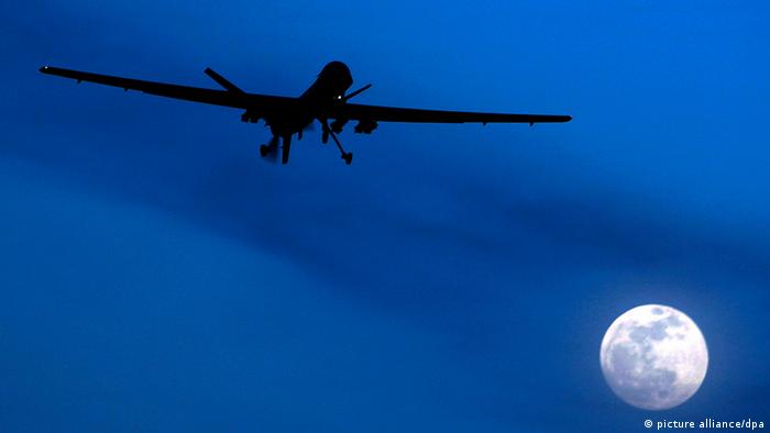 In this Jan. 31, 2010 file photo an unmanned U.S. Predator drone flies over Kandahar Air Field, southern Afghanistan, on a moon-lit night. Drones are often called the weapon of choice of the Obama administration, which quadrupled drone strikes against al-Qaida targets in Pakistan's lawless tribal areas, up from less than 50 under the Bush administration to more than 220 in the past three years. (AP Photo/Kirsty Wigglesworth, File)
