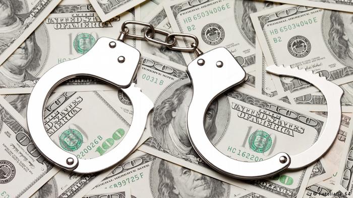 Crime law handcuffs arrests paper dollars currency  Handcuffs on dollar currency © ia_64 #28990358