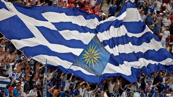 Greece soccer fans cheer for their team at the Euro 2012 soccer championship