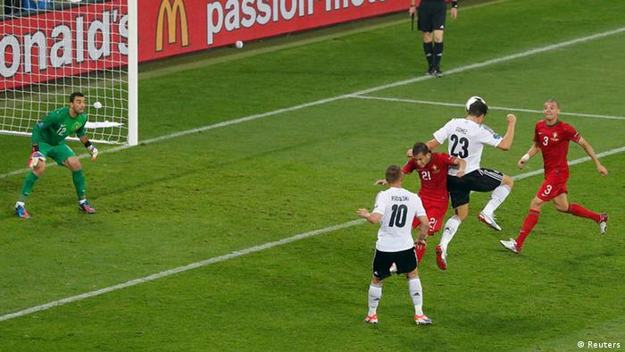 Germany's Mario Gomez (2R) scores a goal against Portugal's Rui Patricio during their Group B Euro 2012 soccer match at the new stadium in Lviv, June 9, 2012. REUTERS/Darren Staples (UKRAINE - Tags: SPORT SOCCER)