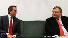 New Democracy leader Antonis Samaras (L) and Greek Socialist party (PASOK) leader Evangelos Venizelos (R) speak during a meeting in the Greek Parliament, in Athens, Greece, on June 18, 2012. 
