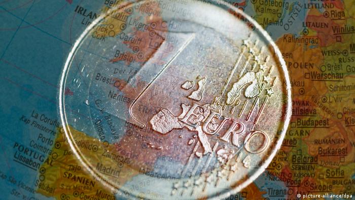 Euro coin over a map of Europe