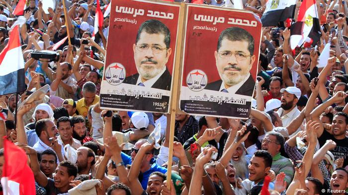 Supporters of Muslim Brotherhood's presidential candidate Mohamed Morsy celebrate his victory at the election at Tahrir Square in Cairo 