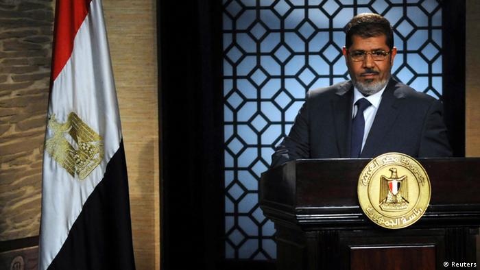 Mohamed Morsi speaks during his first televised address 