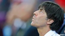 Germany's coach Joachim Loew concentrates before the Euro 2012 semi-final soccer match against Italy at National Stadium in Warsaw