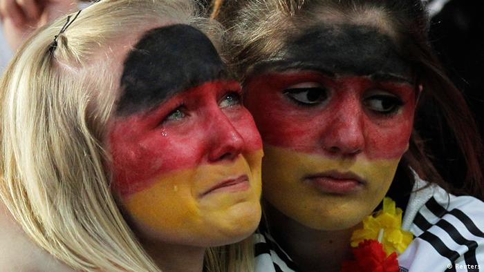 Two female German fans can't hide their dissappointment at the defeat