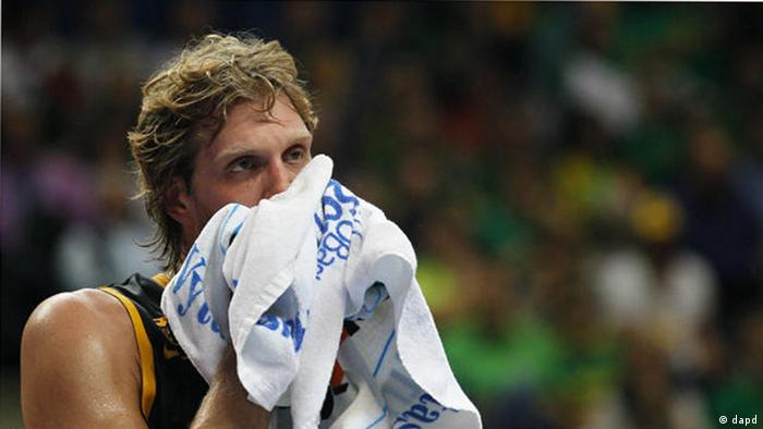 Germany's Dirk Nowitzki wipes his face during their EuroBasket European Basketball Championship Group E match against Lithuania in Vilnius