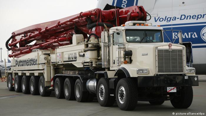 The world's largest concrete pump truck arrives at the New Tokyo International Airport in Narita, east of Tokyo, April 11, 2011. Two pump trucks, each having a 70 meter-long arm, were transported by air to Japan to cool troubled nuclear reactors at the Fukushima No. 1 (Daiichi) nuclear power plant in northern Japan. Tokyo Electric Power Co. (TEPCO), the operator of the plant, bought the trucks from German heavy machinery maker Putzmeister Holding GmbH. There are only five such pump trucks globally .