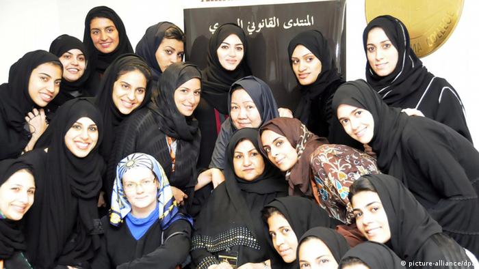 15 Saudi women who are going to be the first Saudi women lawyers, around their professors 