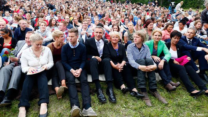 Members of AUF (The Labour Youth Organisation) sit with guests and relatives of those who died a year ago, on Utoeya island July 22, 2012, during the one year anniversary of the twin Oslo-Utoeya massacre by self confessed killer Anders Behring Breivik.(Photo: REUTERS/Heiko Junge/NTB Scanpix)
