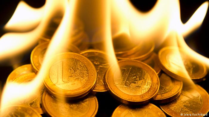Euro coins on fire