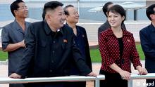In this undated photo released by the Korean Central News Agency (KCNA) and distributed in Tokyo by the Korea News Service Thursday, July 26, 2012, North Korean leader Kim Jong Un, front left, accompanied by his wife Ri Sol Ju, front right, inspects the Rungna People's Pleasure Ground in Pyongyang. North Korea said its new, young leader Kim Jong Un is married, announcing it for the first time in a brief and routine state TV report Wednesday evening that ends weeks of speculation about a beautiful woman who accompanied him to recent public events. (Foto:Korean Central News Agency via Korea News Service/AP/dapd) JAPAN OUT UNTIL 14 DAYS AFTER THE DAY OF TRANSMISSION