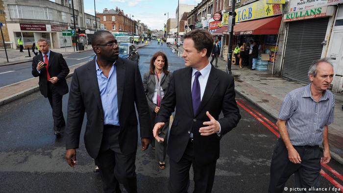 David Lammy (l) and Deputy Prime Minister Nick Clegg meet local residents and business people after rioting broke out in Tottenham, north London, Britain, 08 August 2011.
