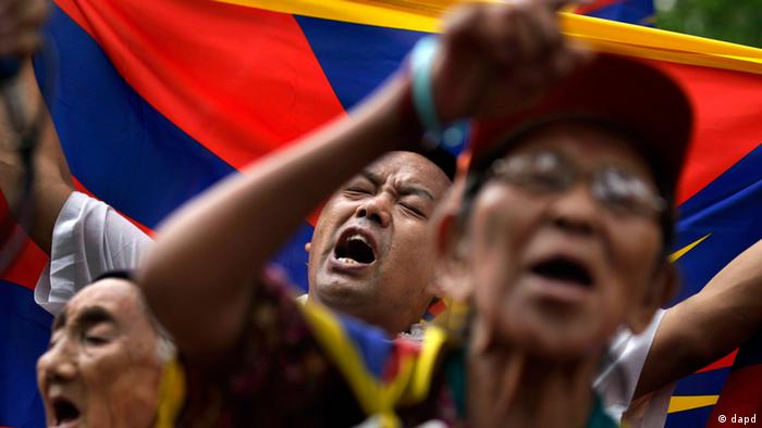 Tibetan exiles shout slogans during a protest against the Chinese government in Delhi, India, Friday, July 13, 2012. (AP Photo/Saurabh Das)