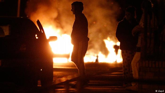 A fire is seen during civil disturbances in Salford near Manchester, England, Tuesday, Aug. 9 2011