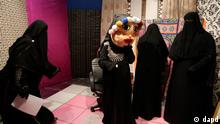 Staff members of the Maria Channel prepare to film a segment of a Ramadan program at their studio in Cairo, Egypt, Monday, July 23, 2012. The first Egyptian satellite channel operated by women wearing the niqab, or face veil, launched on the first day of the holy month of Ramadan. The station manager says he hopes the full face-veiled women will set an example for others by showing a new kind of woman as a role model.(Foto:Maya Alleruzzo/AP/dapd)