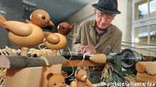 Klaus Weber works on his wooden toys