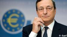Mario Draghi in front of a symbol of the euro currency
(Photo: no info)