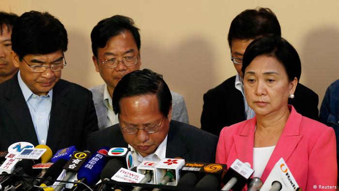 Albert Ho Chun-yan reacts as he announces his resignation from Chairman of the Democratic Party, in between Vice Chairman Emily Lau and member Sin Chung-ka, at the central ballot counting centre of the Legislative Council election in Hong Kong September 10, 2012.Political allies of Hong Kong's new Beijing-backed leader performed solidly in city-wide legislative council elections despite recent controversies over contentious China-linked policies, potentially easing pressure on his administration.REUTERS/Tyrone Siu (CHINA - Tags: POLITICS ELECTIONS)